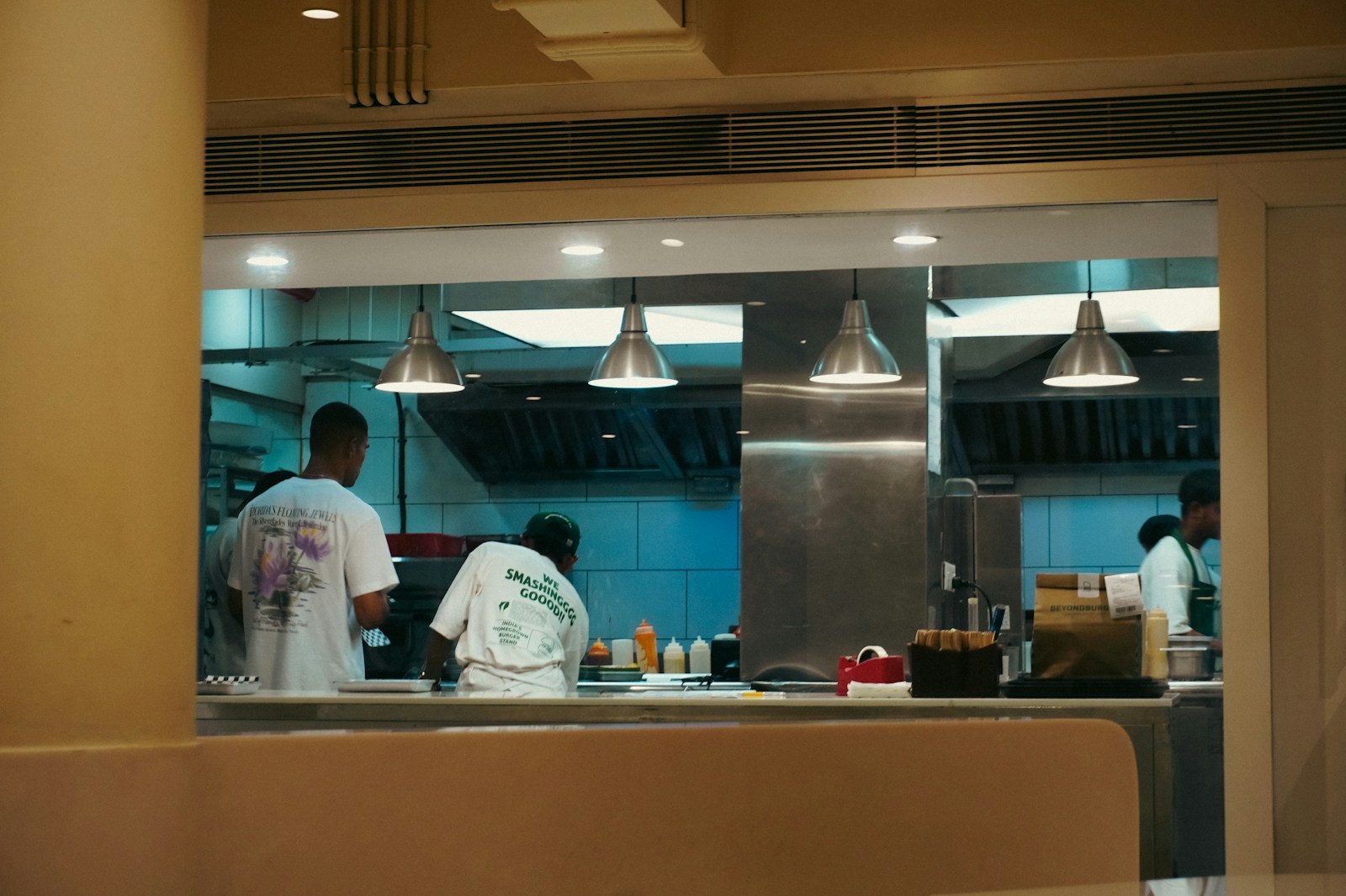 Team working around a commercial kitchen extraction system
